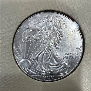 16 silver-clad American Eagle Silver Dollars & 1986-2014 Collector Album